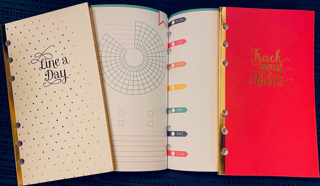 Assorted 6-ring planner pages: two small notebooks labelled "Line a Day" and "Track your Habits" and a page showing a circular tracker and a page with spaces labeled for the 7 days of the week.